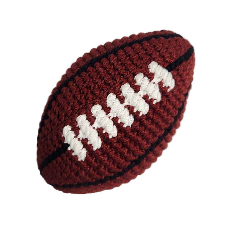 Knitted football toy on a white background